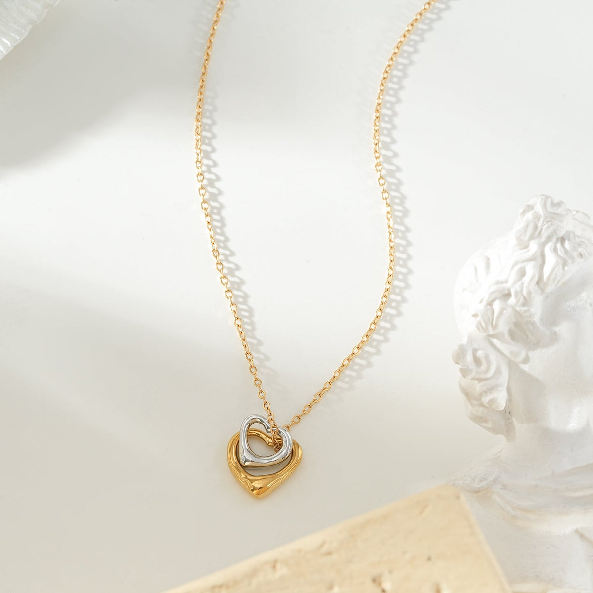 Two Abstract Heart Charms in Gold & Silver