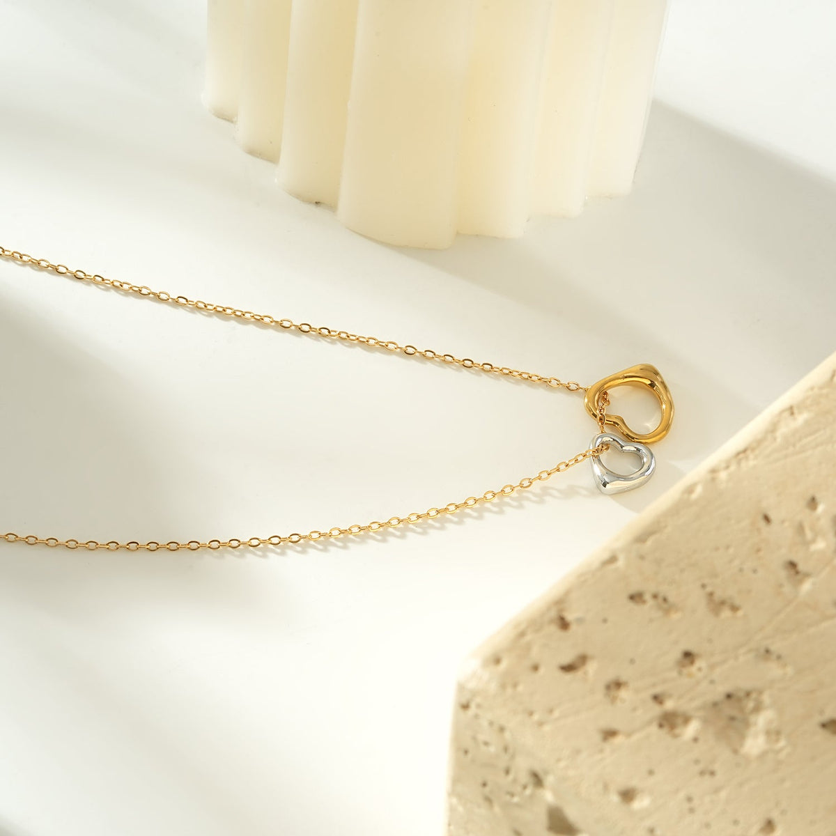 Two Abstract Heart Charms in Gold & Silver