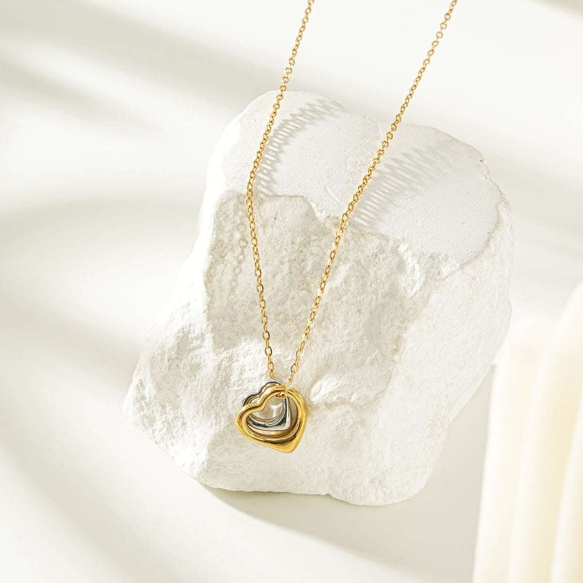 Two Abstract Heart Charms in Gold & Silver