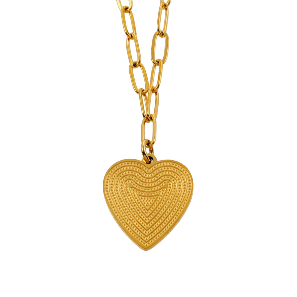 Mini Paper Clip Chain Anchoring a Patterned Heart Charm in Gold